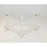 A MODERN LUCITE AND GLASS TABLE