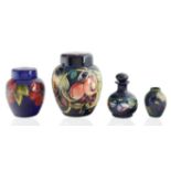 A GROUP OF FOUR FLORIAN AND FRUIT VASES, MOORCROFT, STOKE-ON-TRENT, DESIGNED MID-LATE 20TH CENTURY