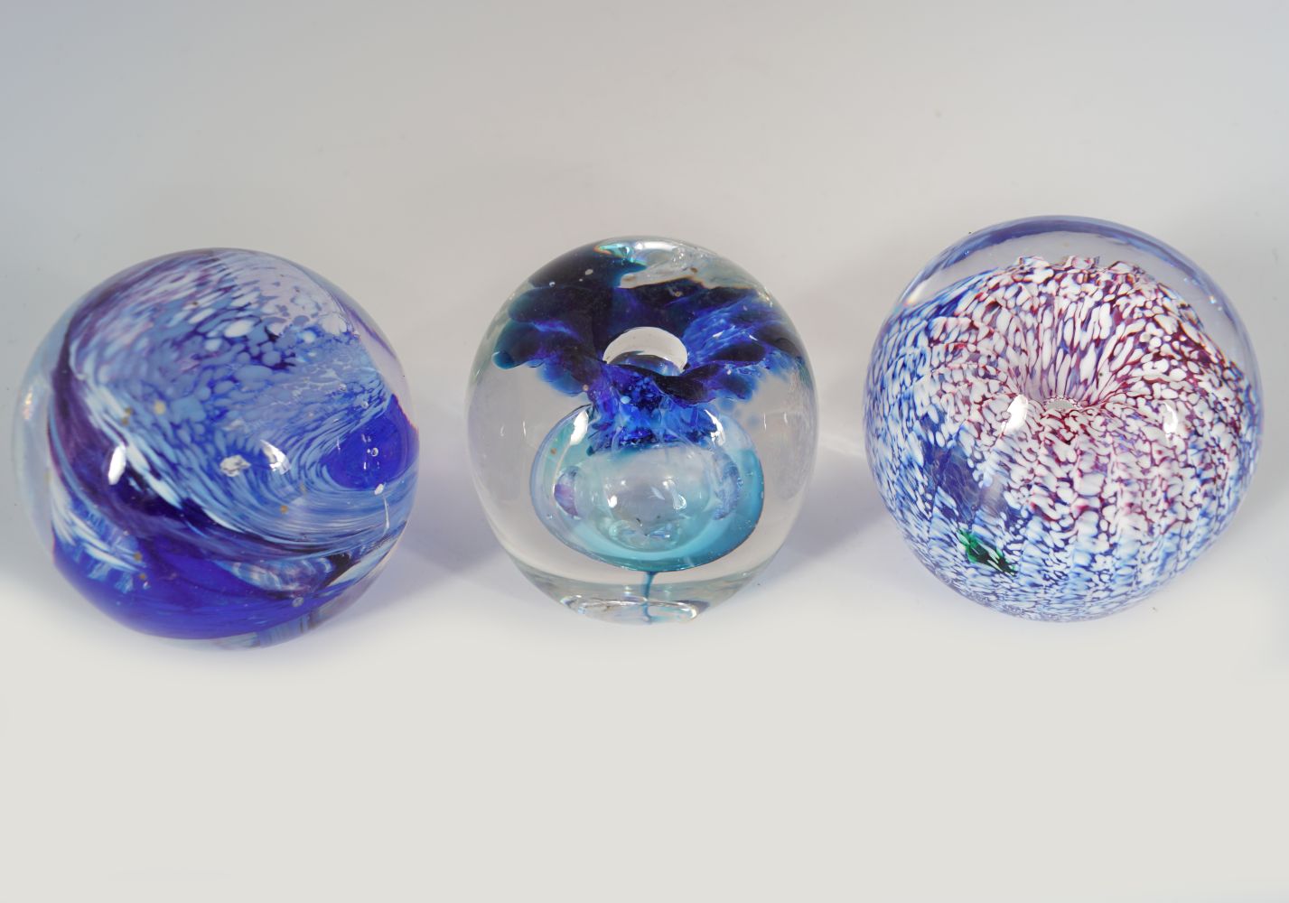SET OF THREE CUT GLASS PAPERWEIGHTS