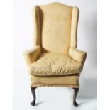 EDWARDIAN MAHOGANY AND UPHOLSTERED WINGBACK CHAIR