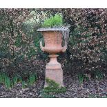 PAIR OF TERRACOTTA URNS ON STAND