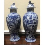 PAIR OF CHINESE QING BLUE AND WHITE URNS