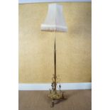 EDWARDIAN BRASS STANDARD LAMP AND SHADE