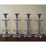 SUITE OF FOUR SHEFFIELD LYRE STEMMED CANDLESTICKS