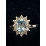 18CT WHITE GOLD AQUAMARINE AND DIAMOND CLUSTER RING