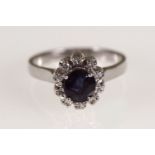 WHITE GOLD AND BLACK CABOCHON SAPPHIRE RING