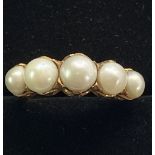 18CT ANTIQUE FIVE STONE GRADUATED PEARL RING