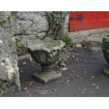 PAIR OF MOULDED STONE URNS