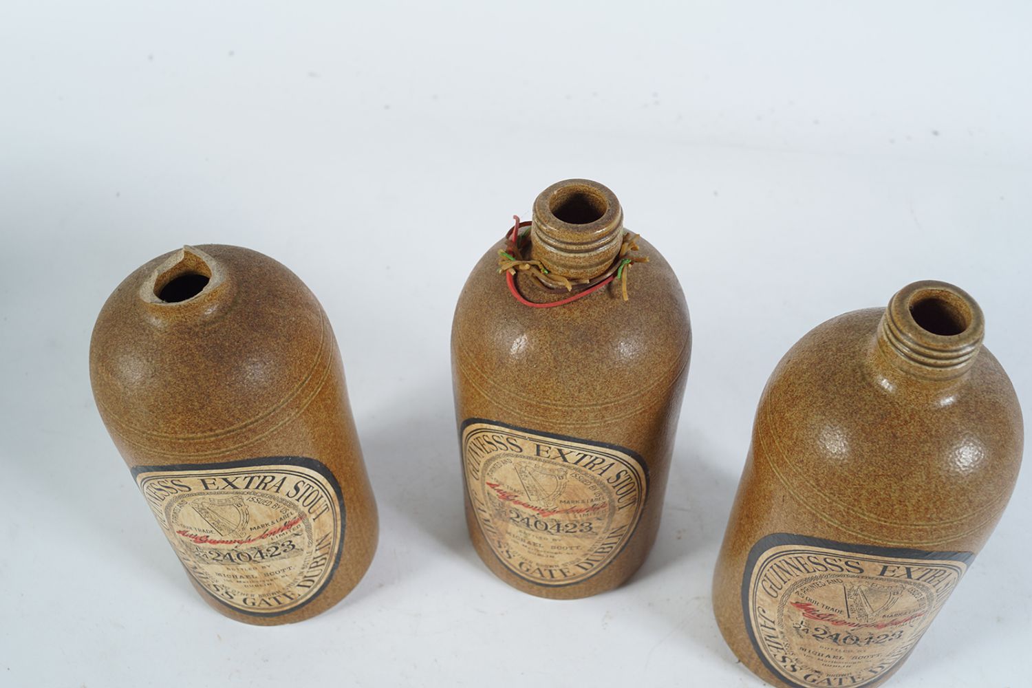 THREE ORIGINAL EARTHENWARE GUINNESS BOTTLES - Image 6 of 6