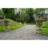 PAIR OF ITALIANATE STONE URNS