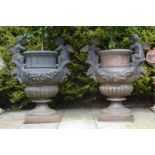 PAIR OF LARGE CAST IRON URNS