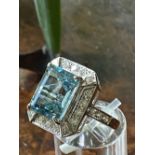 18CT. WHITE GOLD AQUAMARINE AND DIAMOND RING