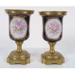 PAIR OF SÈVRES AND ORMOLU URNS