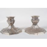 PAIR OF ORNATE SILVER-PLATED CANDLESTICKS