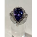 PEAR SHAPED TANZANITE AND DIAMOND CLUSTER RING