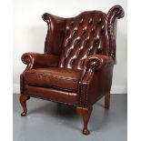 PAIR OF HIDE UPHOLSTERED WING BACK ARMCHAIRS