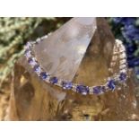 18 CT GOLD TANZANITE & DIAMONDS TENNIS BRACELET