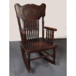 CARVED HARDWOOD CHILD'S ROCKING CHAIR