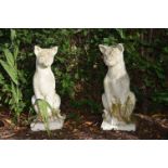 PAIR OF MOULDED STONE GARDEN SCULPTURES