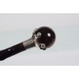ANTIQUE EBONY AND SILVER MOUNTED WALKING STICK