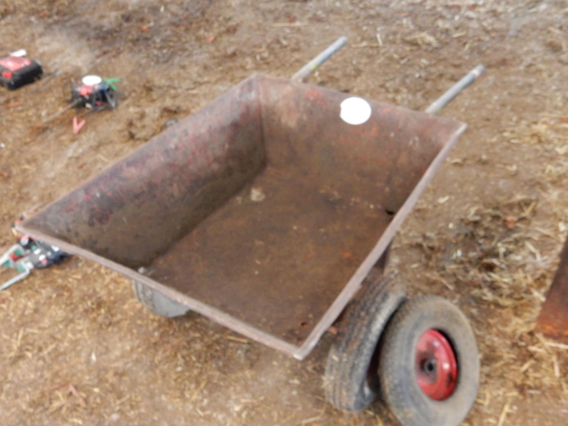 Single axle feed wheel barrow and spare wheel