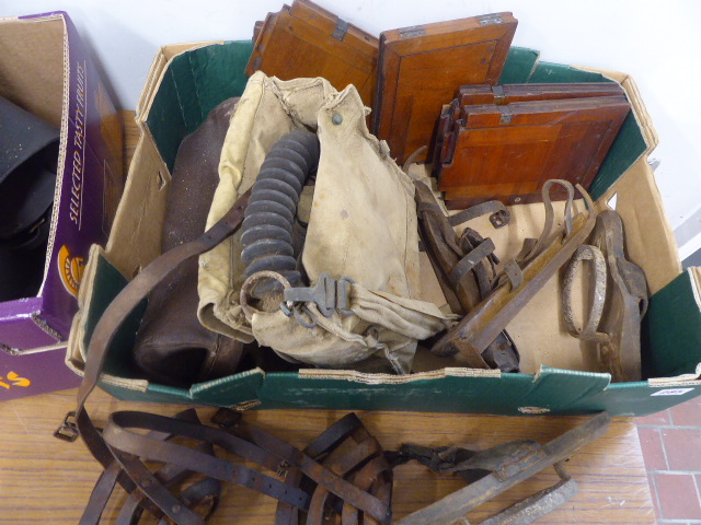 Vintage leather work boots with wooden trees, leather chaps, WWII gas mask,