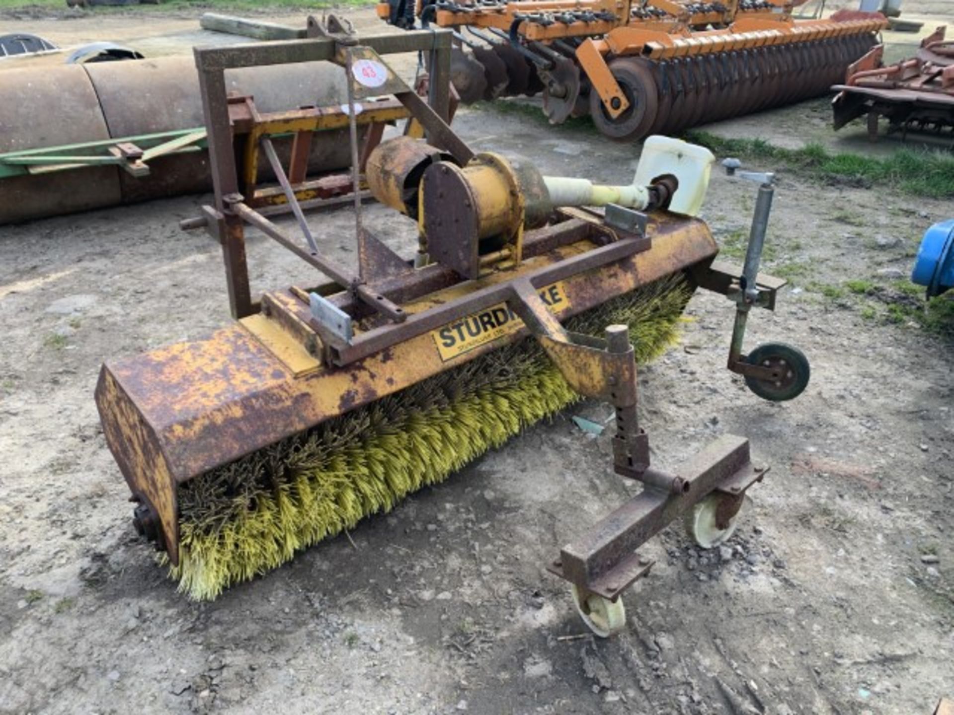 Tractor mounted rotating sweeper