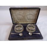Cased pair of silver rimmed salts and spoons - London 1920
