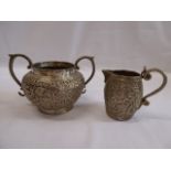 Engraved indian silver? sugar bowl and creamer (2)