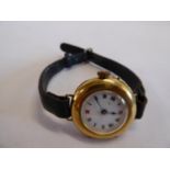 15ct gold cased wristwatch on leather strap