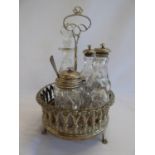 Silver condiments stand, silver topped bottles etc.