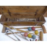 Matched part croquet set in pine box - containing 6 Davidson cast iron hoops, 3 unmarked mallets,