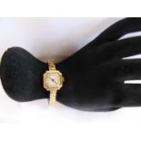 Vintage 9ct gold ladies wristwatch on plated expandable bracelet (16.