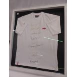 Framed signed retro England style football shirt bearing autographs of the 1966 World Cup wining