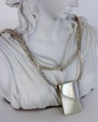 A DESIGN PENDANT WITH NECKLACE Silver. Signed. 79 cm long, approximately 39 grams.