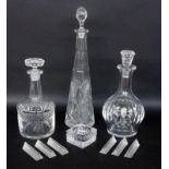A LOT OF 9 GLASS ITEMS. 2 crystal carafes with stopper, 6 knife rests and ashtray.
