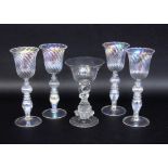 A SET OF 4 VENETIAN WINE GLASSES Probably Murano. Colourless glass with light lustre.