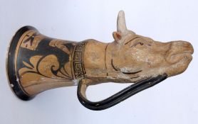 A RHYTON WITH BUFFALO HEAD Ceramic with antique-style painting. 28 cm long. One horn
