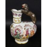A CAPODIMONTE STYLE WINE JUG With colourfully painted antique dance scenes in the relief.