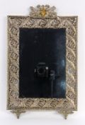 A WALL MIRROR Rectangular with floral decorated metal frame and finial. 49 x 31 cm.