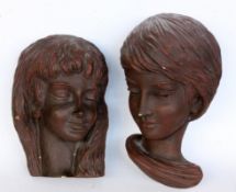 A PAIR OF MASKS Achatit. Ceramic with maker's label and serial number 21 / 26. Small