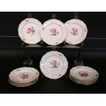 A SET OF 12 DESSERT PLATES Meissen, 20th century Painted with red rose. Diameter 16 cm.