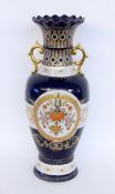 A LARGE FLOOR VASE Porcelain with cobalt blue ground, gold decoration and colourfully