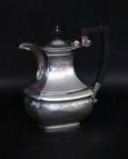 A COFFEE POT Sheffield, England 1925 925/000 sterling silver. Ebonized wooden handle.