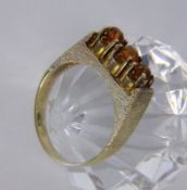 A LADIES RING 585/000 yellow gold with 3 Madeira citrines. Ring size 56, gross weight