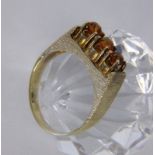 A LADIES RING 585/000 yellow gold with 3 Madeira citrines. Ring size 56, gross weight