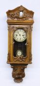 A REGULATOR WALL CLOCK German circa 1900 Walnut case with carvings. Pendulum movement,