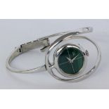 A DESIGNER WRISTWATCH Silver with a malachite-coloured dial. Diameter 6 cm, gross