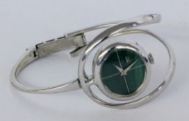 A DESIGNER WRISTWATCH Silver with a malachite-coloured dial. Diameter 6 cm, gross