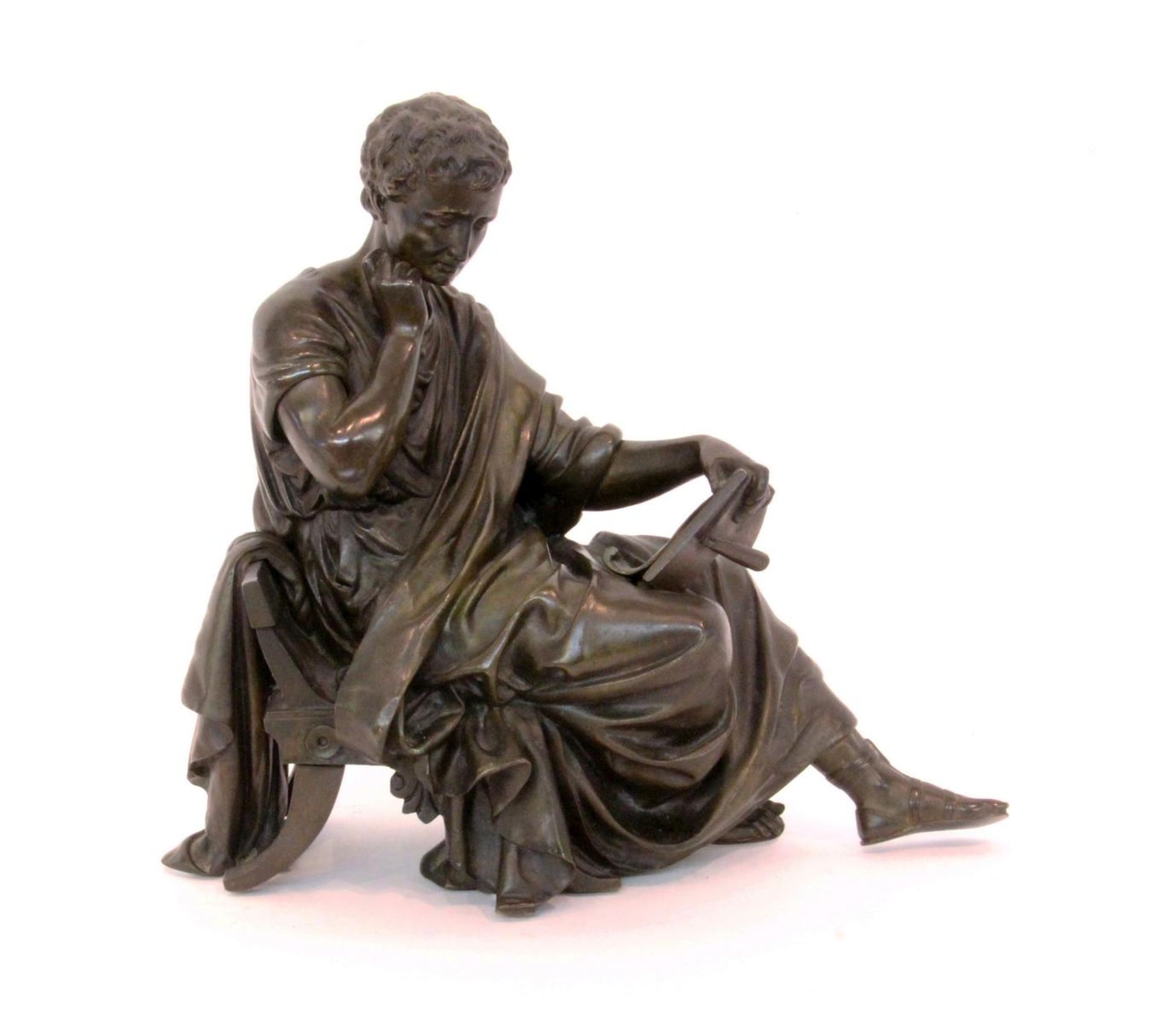 A PHILOSOPHER France circa 1900 Patinated bronze figure of an ancient philosopher reading